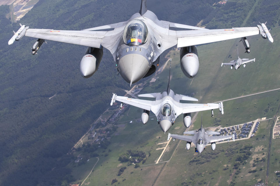 FILE - A Romanian Air Force F- 16s military fighter jet, front, and Portuguese Air Force F- 16s military fighter jets participating in NATO's Baltic Air Policing Mission operate over the Baltic Sea, Lithuanian airspace, Monday, May 22, 2023. The small Baltic countries are among the top contributors of military aid to Ukraine on a per-capita basis. They're also among the staunchest advocates of inviting Ukraine to join NATO, another sensitive issue in the alliance. (AP Photo/Mindaugas Kulbis, File)