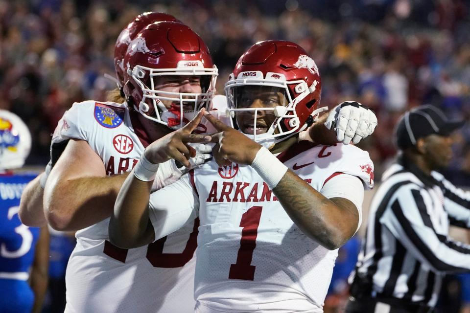 Arkansas quarterback KJ Jefferson (1) gestures toward fans after scoring a touchdown against Kansas during the first half of the Liberty Bowl NCAA college football game Wednesday, Dec. 28, 2022, in Memphis, Tenn. (AP Photo/Rogelio V. Solis)