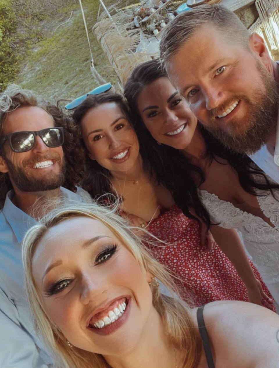 Ashley Favret, Sam Miller’s maid of honor, takes a selfie with (from left) Jonny Lilly, Brynn Lilly, Sam Miller and Aric Hutchinson.