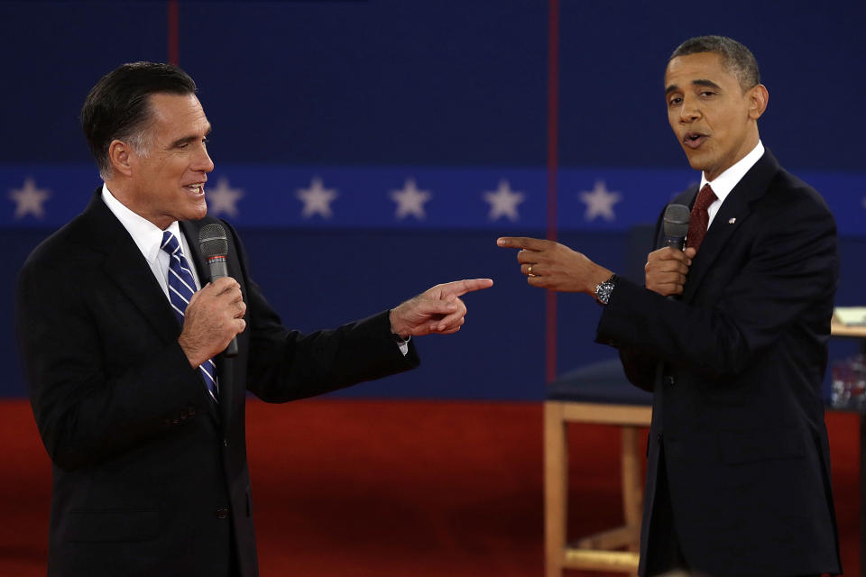 FILE - In this Oct. 16, 2012 file photo, Republican presidential nominee Mitt Romney, left, and President Barack Obama spar during a presidential debate at Hofstra University in Hempstead, N.Y. (AP Photo/Charlie Neibergall, File)