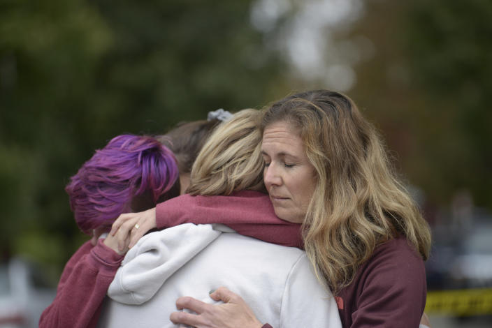 <p>From left Cody Murphy, 17 Sabrina Weihrauch, and Amanda Godley, left, all of Pittsburgh, hug after an active shooter situation at Tree of Life Synagogue on Saturday, Oct. 27, 2018. (Photo: Andrew Stein/Pittsburgh Post-Gazette via AP) </p>