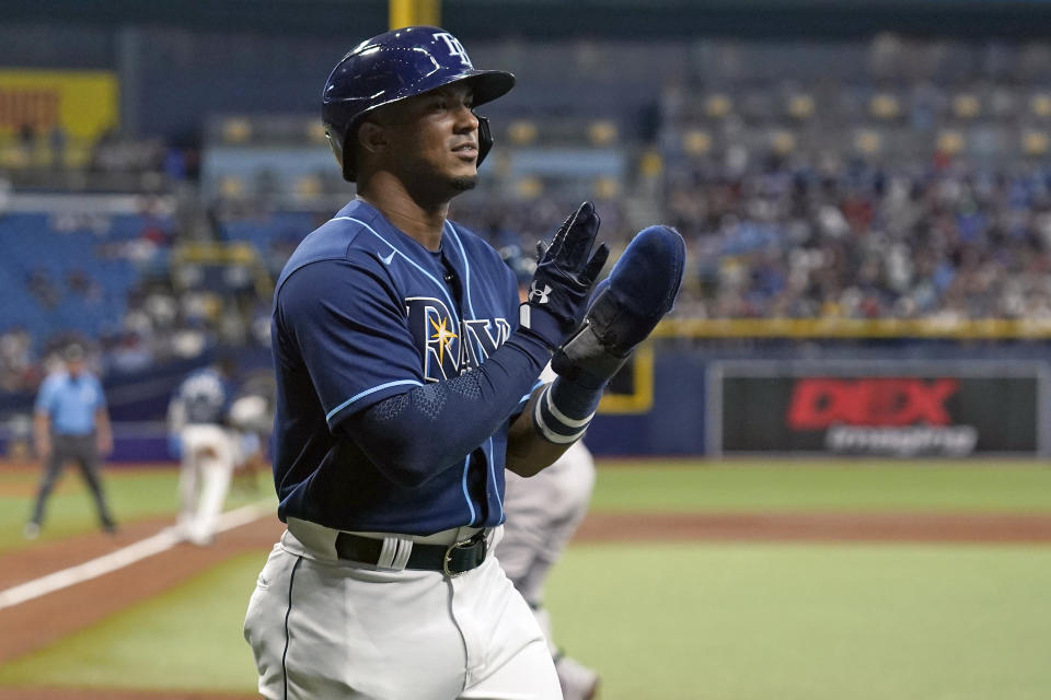 Tampa Bay Rays' Wander Franco reacts after scoring on a two-run single by Francisco Mejia off Boston Red Sox starting pitcher Eduardo Rodriguez during the first inning of a baseball game Tuesday, June 22, 2021, in St. Petersburg, Fla. (AP Photo/Chris O'Meara)