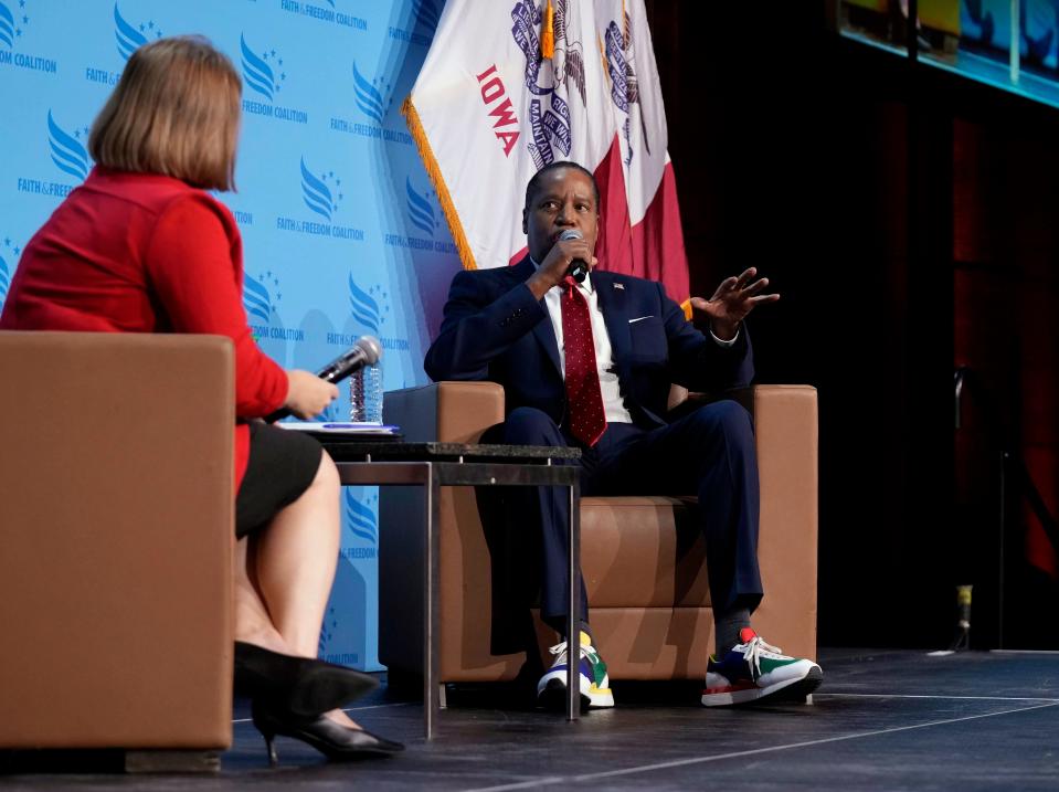 Iowa Attorney General Brenna Bird, left, interviews Republican presidential candidate Larry Elder at the Iowa Faith and Freedom Coalition's banquet, Saturday, Sept. 16, 2023, in Des Moines, Iowa. (AP Photo/Bryon Houlgrave)