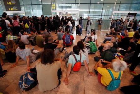 Protesters block an entrance to the airport due to a verdict in a trial over a banned independence referendum, in Barcelona