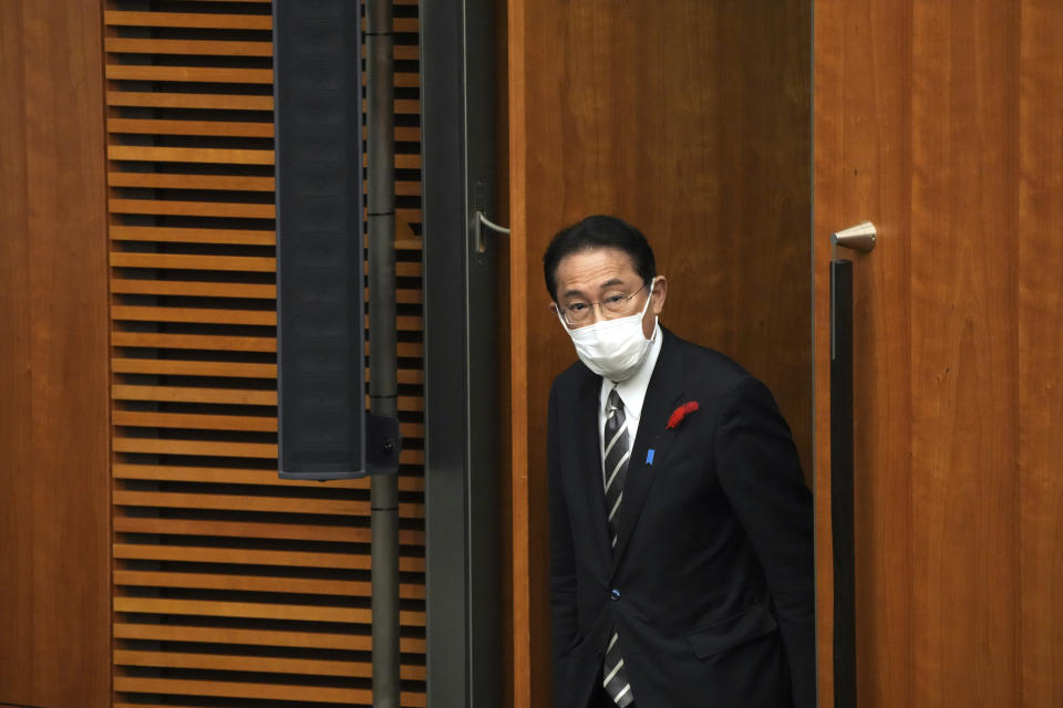 Japanese Prime Minister Fumio Kishida walks for a news conference at the prime minister's official residence Thursday, Oct. 14, 2021, in Tokyo. Kishida dissolved the lower house of parliament Thursday, paving the way for elections Oct. 31 that will be Japan's first of the pandemic. (AP Photo/Eugene Hoshiko, Pool)