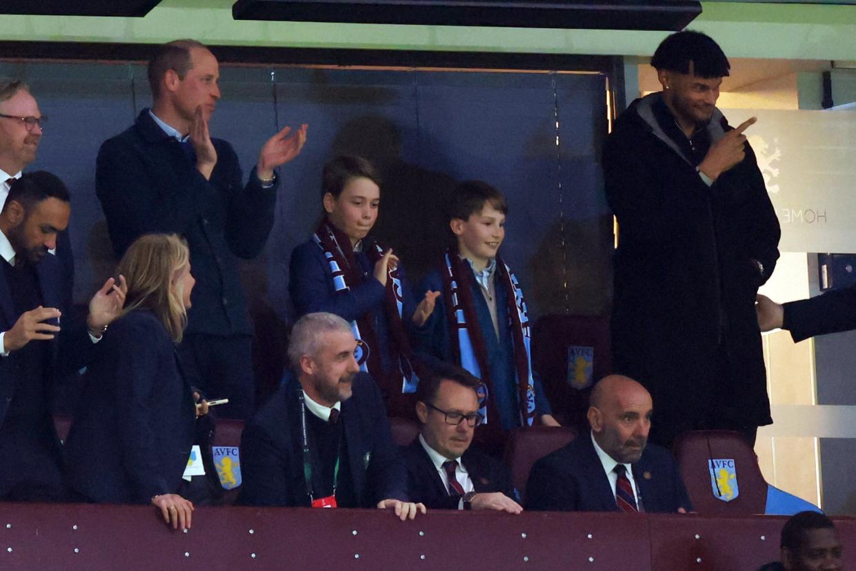 Prince William and George clap at an Aston Villa match on Thursday (Getty Images)