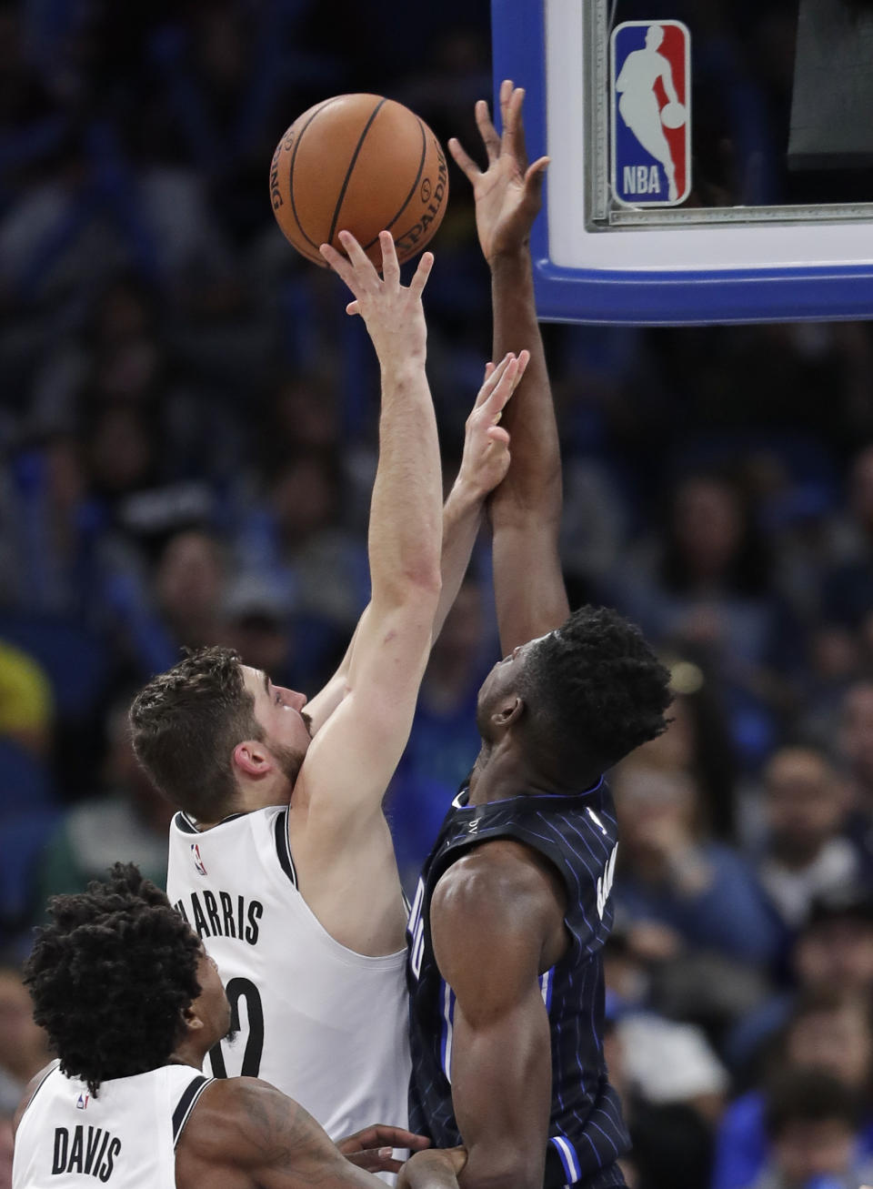 Orlando Magic's Mo Bamba, right, blocks a shot by Brooklyn Nets' Joe Harris, left, during the first half of an NBA basketball game Friday, Jan. 18, 2019, in Orlando, Fla. (AP Photo/John Raoux)