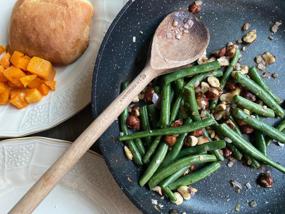 Fresh green beans seasoned with a garlic are wonderful for our typical dinners but the holidays, fresh greens beans accented with shallots and toasted hazelnuts take plain green beans from plain to fancy.