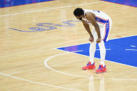 Philadelphia 76ers' Joel Embiid reacts during Game 7 in a second-round NBA basketball playoff series against the Atlanta Hawks, Sunday, June 20, 2021, in Philadelphia. The Hawks advanced with a 103-96 win over the 76ers. Embiid tried to carry the team but was hindered by a knee injury. (AP Photo/Matt Slocum)