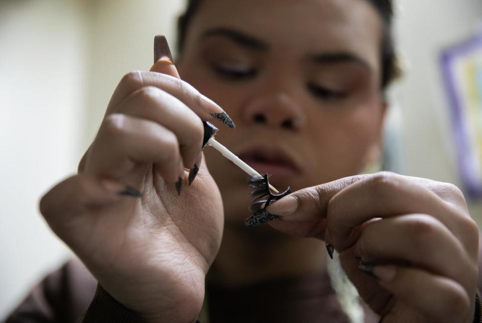 Isabella Morningstar does last touches on her makeup on the morning of Nov. 21, 2023. She says she enjoys doing her hair and nails because while she was in the care of the Texas Department of Family and Protective Services she wasn’t allowed to wear makeup or feminine clothing.