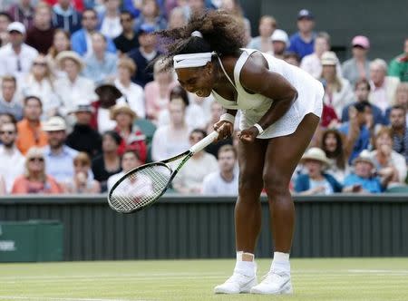 Serena Williams of the U.S.A. reacts during her match against Heather Watson of Britain at the Wimbledon Tennis Championships in London, July 3, 2015. REUTERS/Suzanne Plunkett