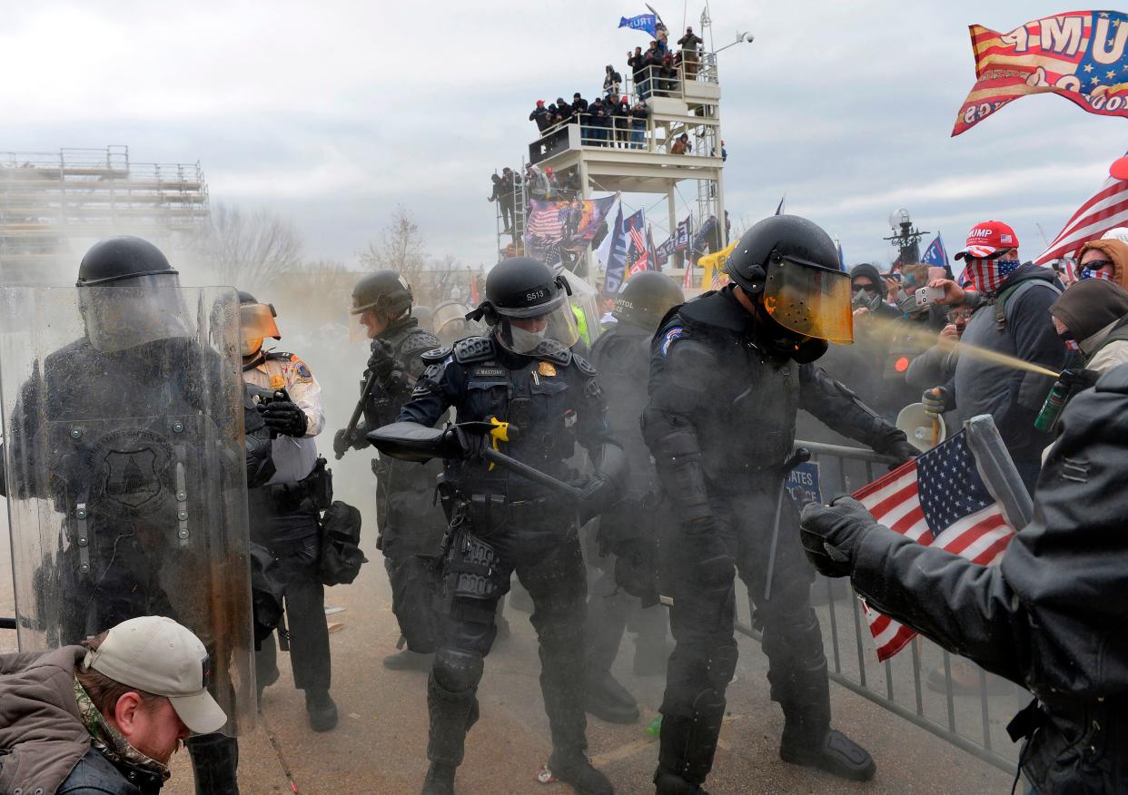 Trump supporters clash with police and security forces as they try to storm the US Capitol in Washington, DC on January 6, 2021. 