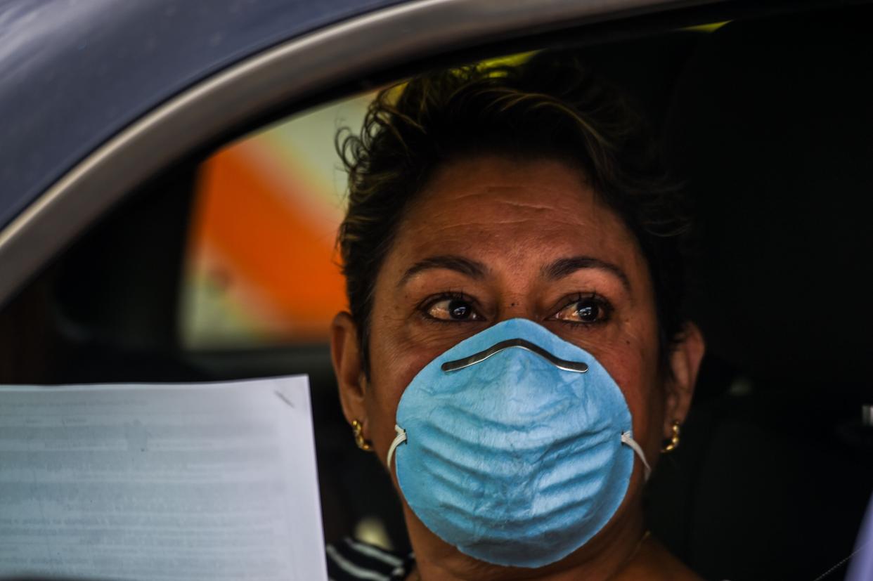 People wait in their cars as they line up outside John F. Kennedy Library to collect unemployment forms in Hialeah, Florida, on April 8, 2020. The city is distributing printed forms as people are having trouble accessing the state of Florida&rsquo;s unemployment website. (Photo: CHANDAN KHANNA/AFP via Getty Images)