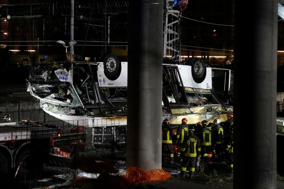 Italian firefighters work at the scene of a passenger bus accident in Mestre, near Venice, Italy, Wednesday, Oct. 4, 2023.