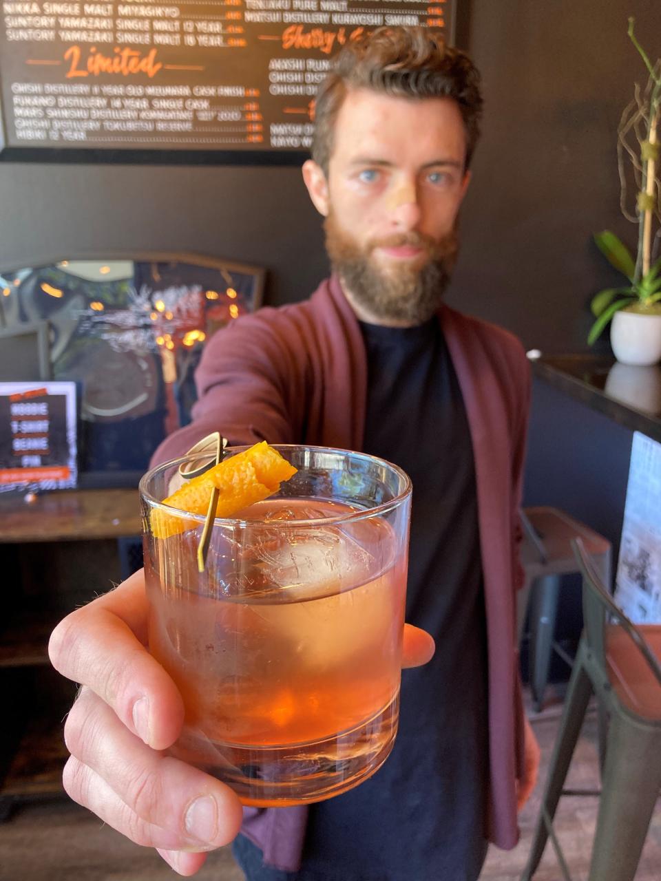 TJ Annese, the bar manager at Ani Ramen in Larchmont, uses honey as a base to add to the depth of flavor for his Old Fashioned's. He also uses eight dashes of bitters, a tad more than the usual five. Photographed May 2022.