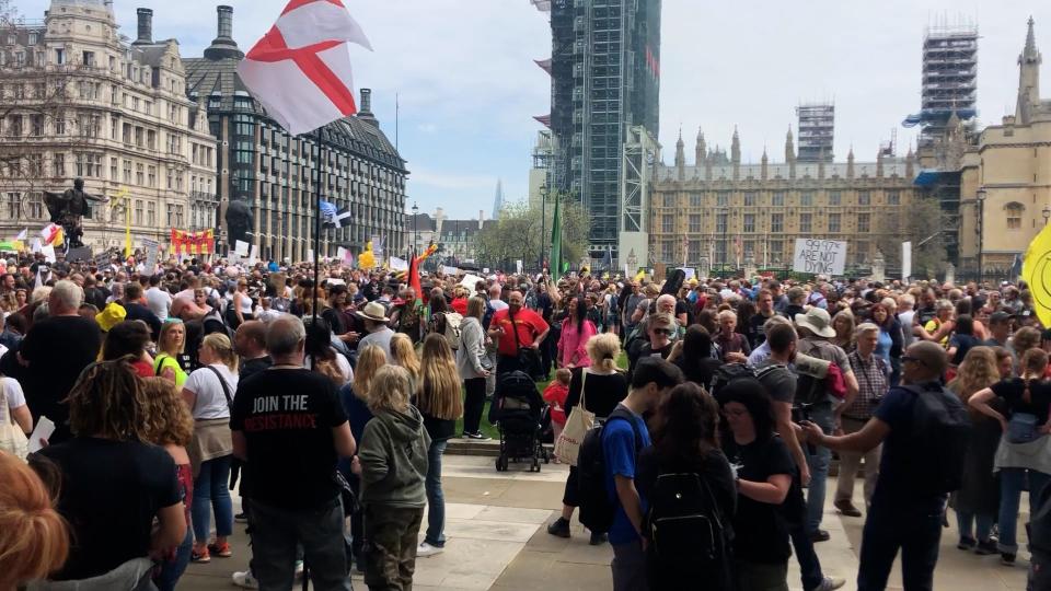 People take part in an anti-vaccine protest in Parliament Square (PA Wire)