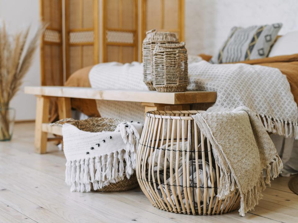 neutral colored bedroom with lots of woven and wooden design details