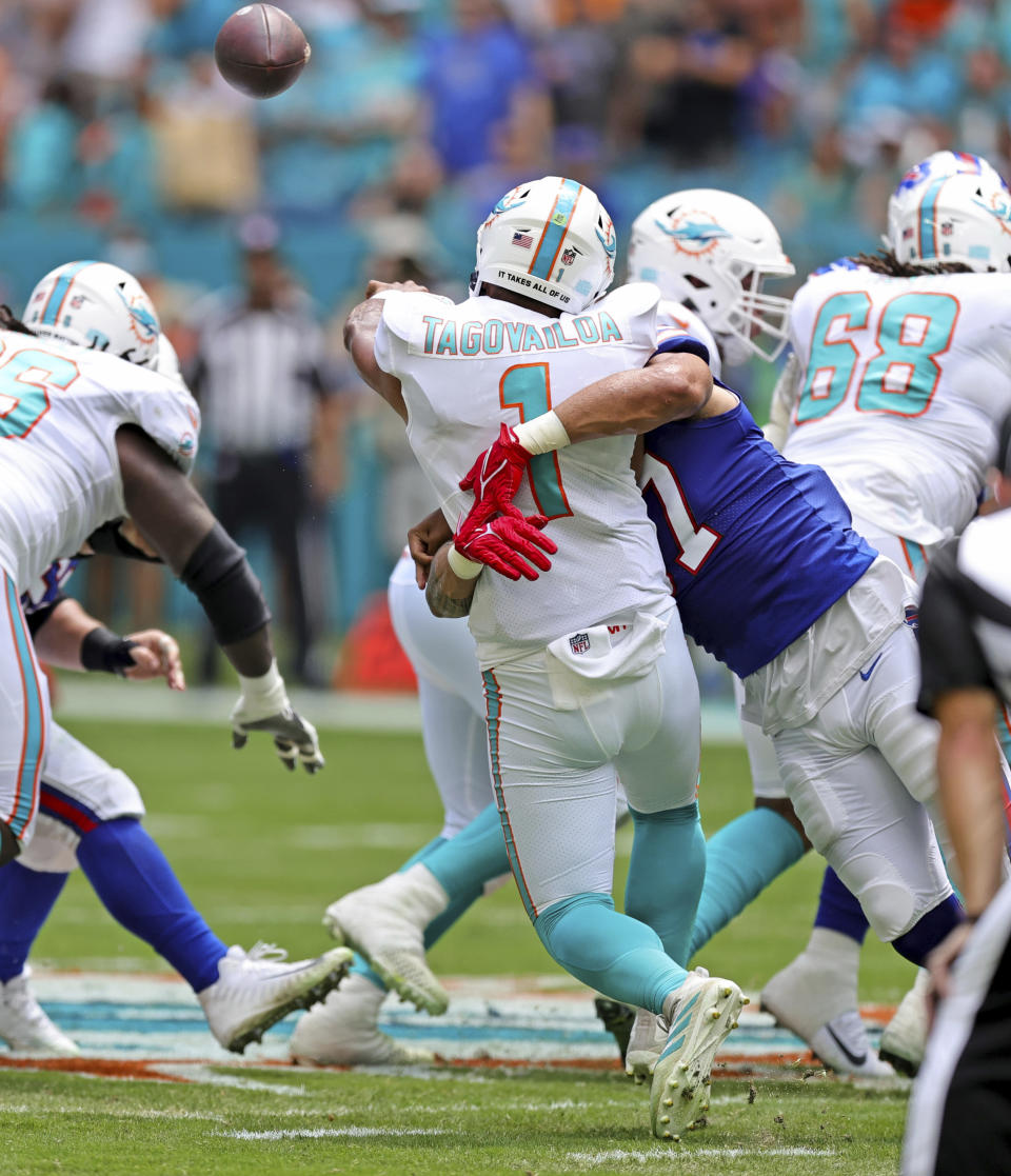 Miami Dolphins quarterback Tua Tagovailoa (1) is sacked by Buffalo Bills defensive end A.J. Epenesa (57) during the first quarter of an NFL football game Sunday, Sept. 19, 2021, in Miami Gardens, Fla. A battery of tests run on Tagovailoa failed to show any serious problems other than bruised ribs, raising at least the possibility that he could play next weekend when the Dolphins (1-1) visit the Las Vegas Raiders (2-0). (David Santiago/Miami Herald via AP)