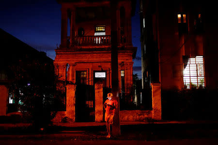 Self-employed Yoselby Alvarez, 35, uses the internet at a hotspot in Havana, Cuba, April 5, 2018. REUTERS/Alexandre Meneghini