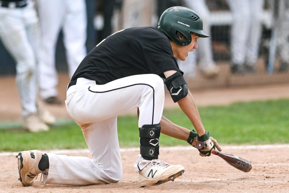 Phil Hampton bunts in a run that gave Howell a 4-3 lead in the top of the seventh inning against Brighton on Saturday, June 4, 2022 in East Lansing.