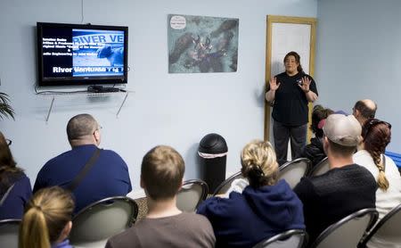 River Ventures tour operations manager Brandi Bruton gives the required orientation to guests before heading out to snorkel with the manatees at Three Sisters Springs in Crystal River, Florida January 15, 2015. REUTERS/Scott Audette