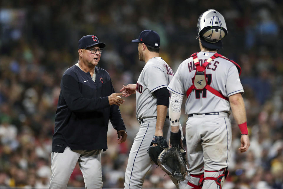 Cleveland Guardians starting pitcher Aaron Civale, center, is relieved by manager Terry Francona, left, in the fifth inning a baseball game against the San Diego Padres, Tuesday, Aug. 23, 2022, in San Diego. (AP Photo/Derrick Tuskan)