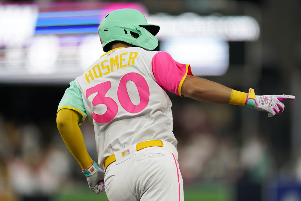 San Diego Padres' Eric Hosmer reacts after hitting a home run during the fourth inning of a baseball game against the Minnesota Twins, Friday, July 29, 2022, in San Diego. (AP Photo/Gregory Bull)