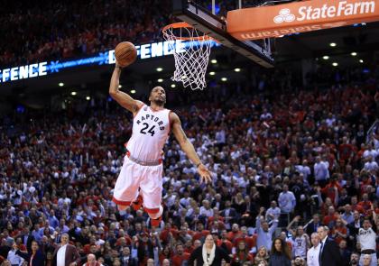 TORONTO, ON - APRIL 26:  Norman Powell #24 of the Toronto Raptors dunks the ball late in the second half of Game Five of the Eastern Conference Quarterfinals against the Indiana Pacers during the 2016 NBA Playoffs at the Air Canada Centre on April 26, 2016 in Toronto, Ontario, Canada.  NOTE TO USER: User expressly acknowledges and agrees that, by downloading and or using this photograph, User is consenting to the terms and conditions of the Getty Images License Agreement.  (Photo by Vaughn Ridley/Getty Images)