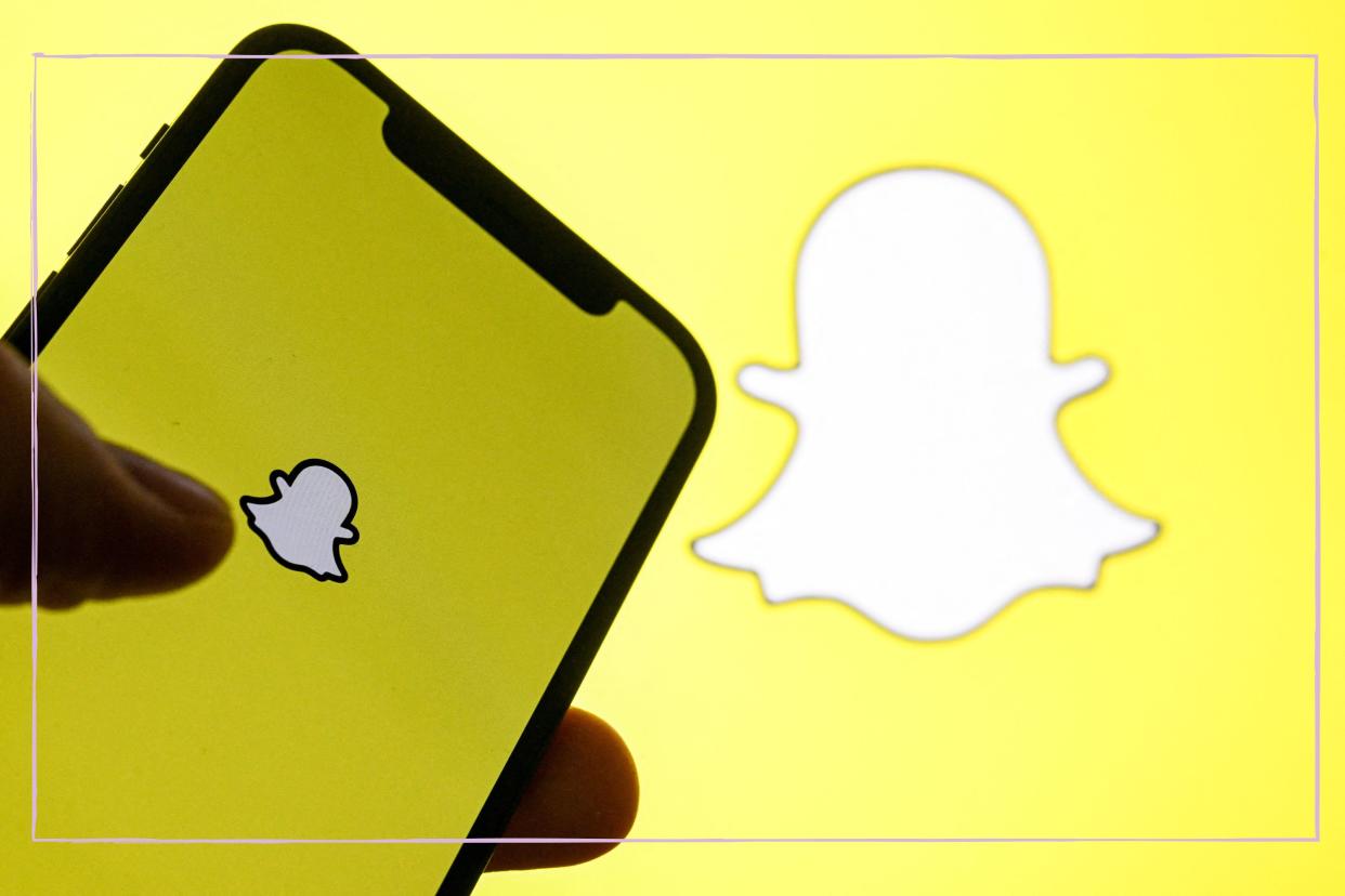  A close up of a phone screen with the Snapchat logo. 