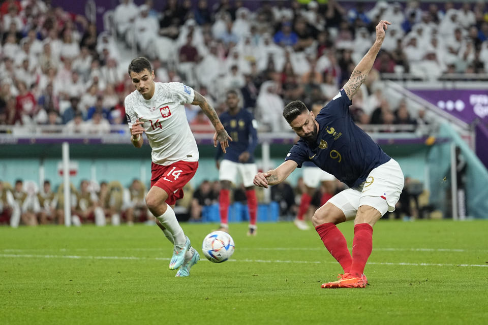 France's Olivier Giroud scores the opening goal during the World Cup round of 16 soccer match between France and Poland, at the Al Thumama Stadium in Doha, Qatar, Sunday, Dec. 4, 2022. (AP Photo/Ebrahim Noroozi)