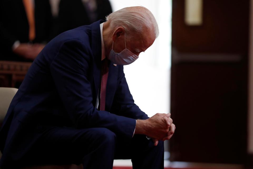 Democratic presidential candidate Joe Biden bows his head in prayer as he visits Bethel AME Church in Wilmington, Del., on June 1, 2020.