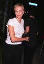 <p>Charlize Theron hugs Keanu Reeves outside the Viper Room after his performance with his band Dogstar on December 18, 1997.</p>