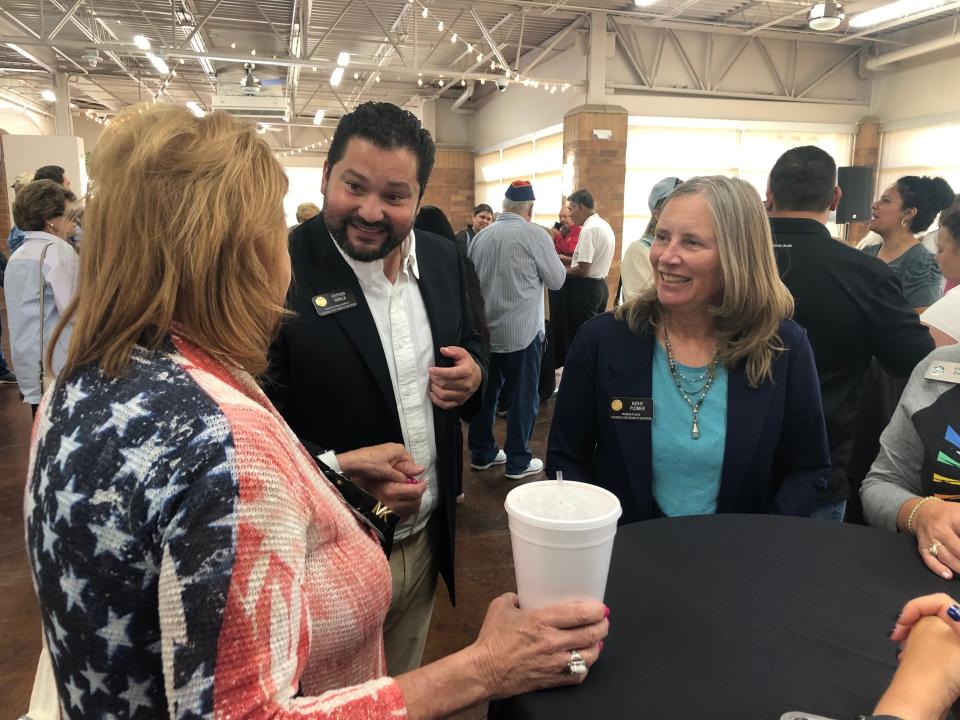 Colorado Department of Education board members Stephen Varela and Kathy Plomer speak with representatives of Pueblo D70 at a Colorado Department of Education Meet & Greet at the Pueblo Convention Center on Wednesday, August 9, 2023.