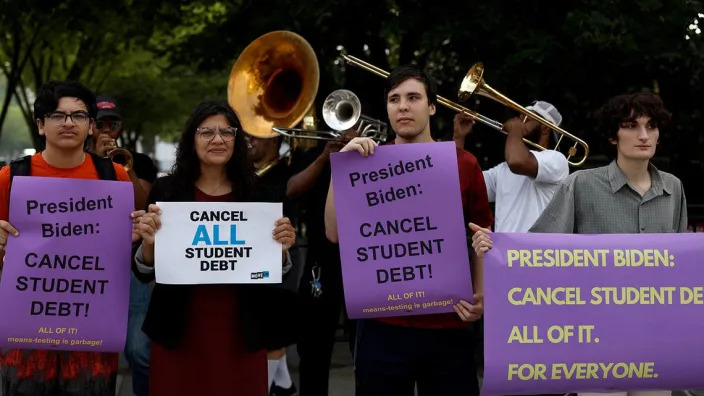 WASHINGTON, DC - JULY 27: Rep. Rashida Tlaib (R-MI) (2nd from L) attends a rally outside of the White House to call on U.S. President Joe Biden to cancel student debt on July 27, 2022 in Washington, DC. Student loan borrowers are awaiting a decision on whether the Biden administration will extend a pause on student loan payments. (Photo by Anna Moneymaker/Getty Images)