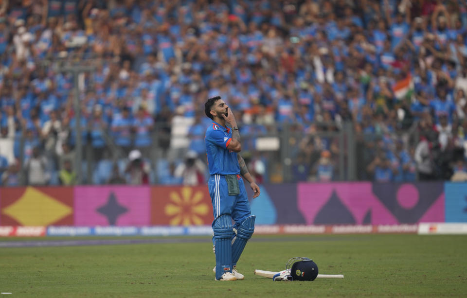 India's Virat Kohli celebrates his century during the ICC Men's Cricket World Cup first semifinal match between India and New Zealand in Mumbai, India, Wednesday, Nov. 15, 2023. (AP Photo/Rafiq Maqbool)
