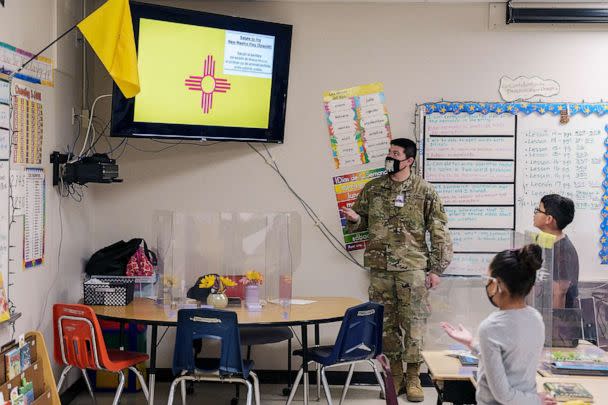 PHOTO: FILE - National Guard soldier Mario Meraz recites the 'Salute to the New Mexico Flag' with students during a third grade class at Highland Elementary School in Las Cruces, New Mexico, March 4, 2022. (Paul Ratje/AFP via Getty Images, FILE)