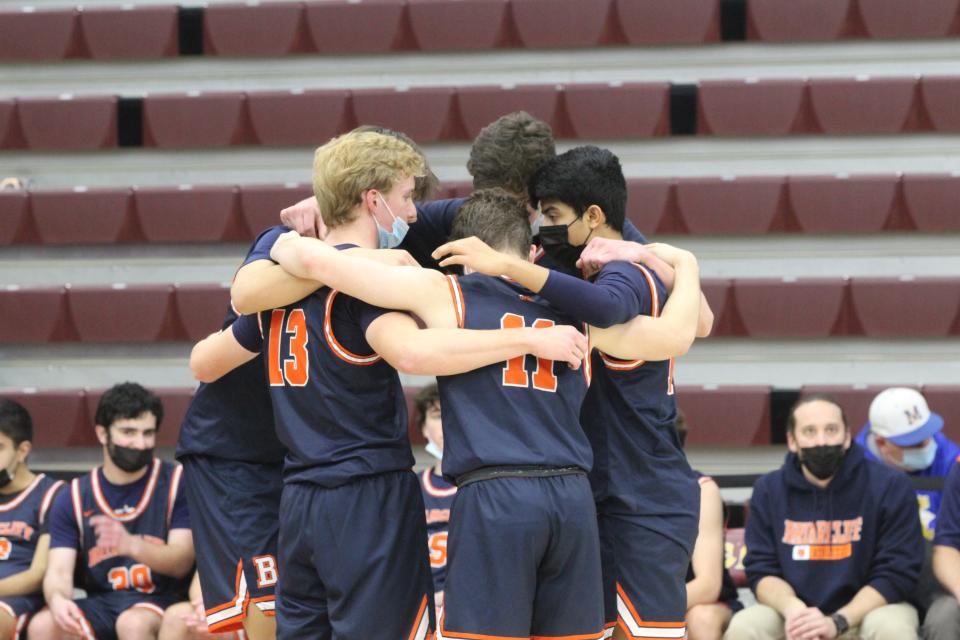 Briarcliff huddles during its game against Hastings. The Yellow Jackets won, 51-43.