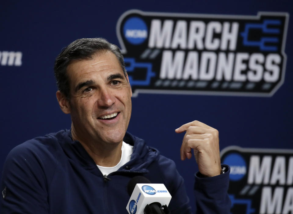 FILE - In this March 22, 2019, file photo, Villanova head coach Jay Wright speaks during a news conference at the men's college basketball NCAA Tournament in Hartford, Conn. Villanova students are headed back to school this week _ while the Villanova men's basketball coach will be halfway around the world for the next month or so. It has been, and will continue being, a major schedule challenge for Wright as he's tasked with both helping USA Basketball win a gold medal while his college players are on campus getting ready to start their seasons. (AP Photo/Elise Amendola, File)