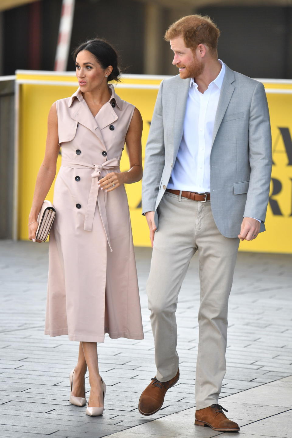 For the Southbank visit, the Duchess of Sussex kept cool in a sleeveless trench dress by House of Nonie [Photo: PA]