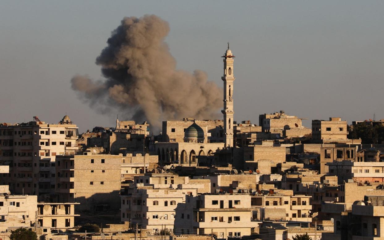 Smoke billows over rebel-held city of Maaret al-Numan in Idlib province after attack by regime air force - AFP