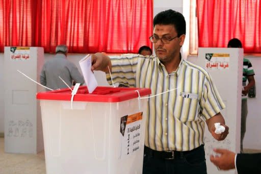 A Benghazi resident casts his ballot on May 19 to elect a local council. An announcement about Libya's national elections will be made on Sunday, an official says