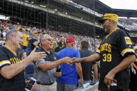 Dave Parker, a member of the 1979 Pittsburgh Pirates World Championship team, right, greets fans before a pre-game ceremony honoring the team before a baseball game between the Pittsburgh Pirates and the Philadelphia Phillies in Pittsburgh, Saturday, July 20, 2019. (AP Photo/Gene J. Puskar)