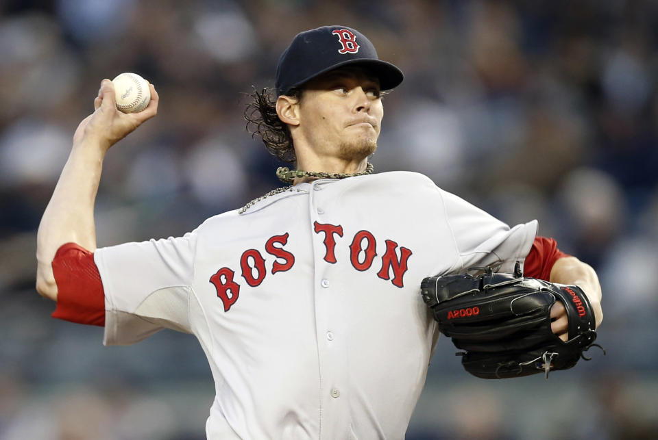 Boston Red Sox starting pitcher Clay Buchholz delivers in the first inning against the New York Yankees in a baseball game at Yankee Stadium in New York, Thursday, April 10, 2014. (AP Photo/Kathy Willens)