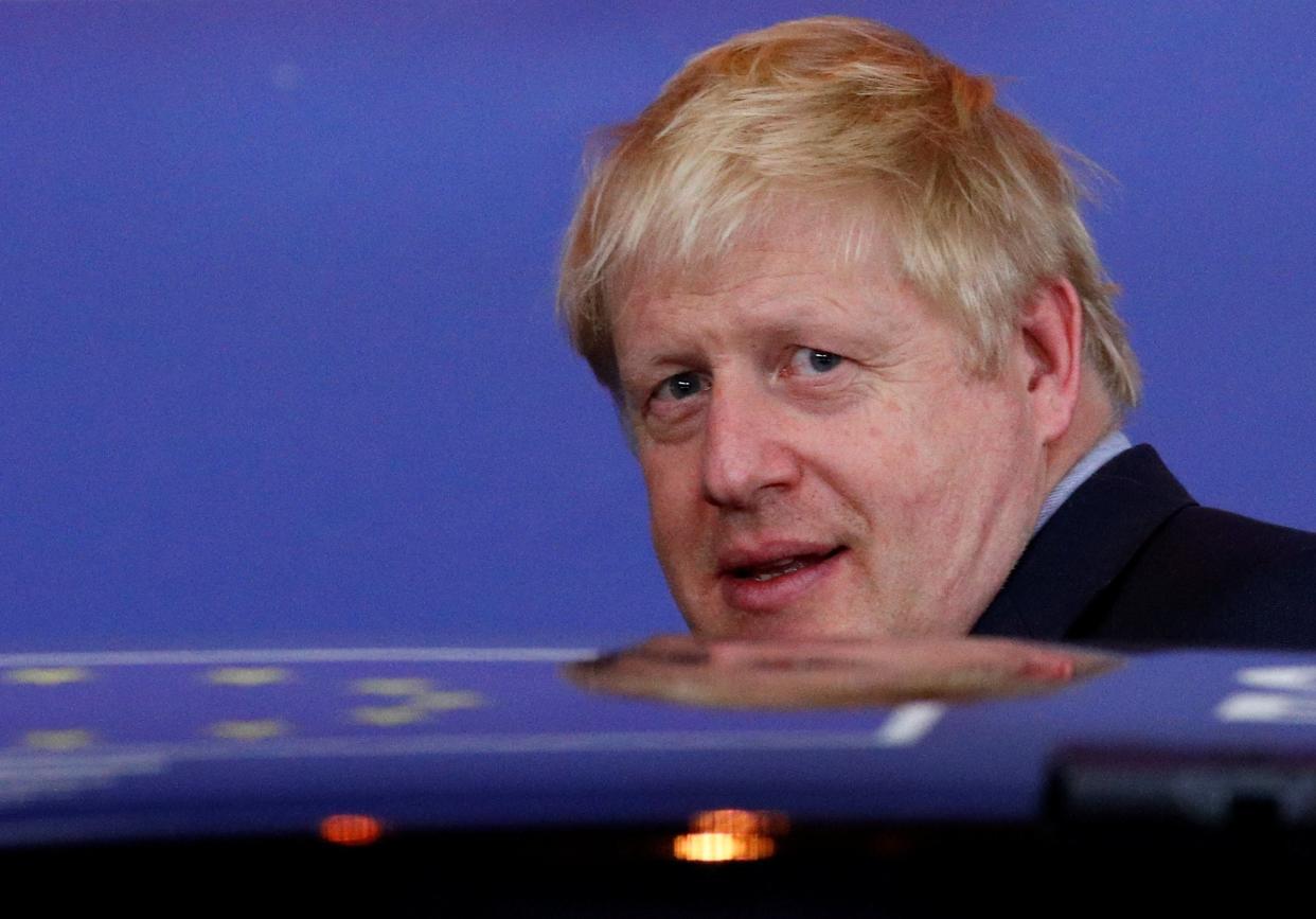 Boris Johnson leaves the European Council in Brussels: REUTERS