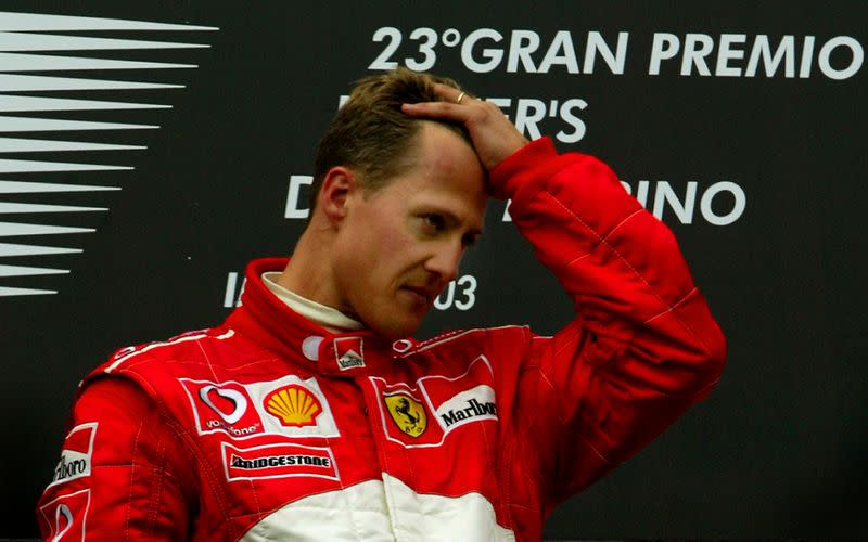 FILE PHOTO: Ferrari's Michael Schumacher is overcome with emotion on the winners podium after claiming victory in the San Marino Grand Prix at Imola just hours after his mother Elisabeth, who was in a coma, died in Cologne.