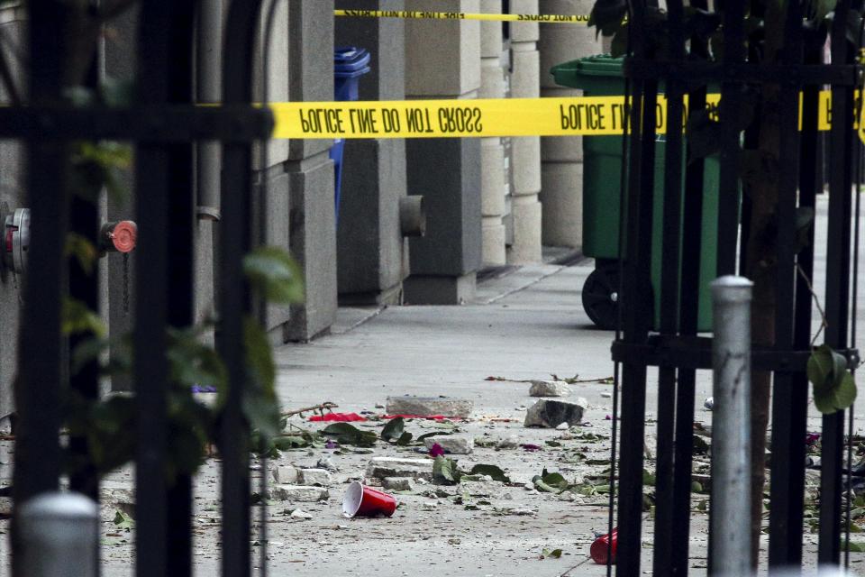 Debris is seen on the sidewalk below a 4th-story apartment building balcony collapse in Berkeley, California