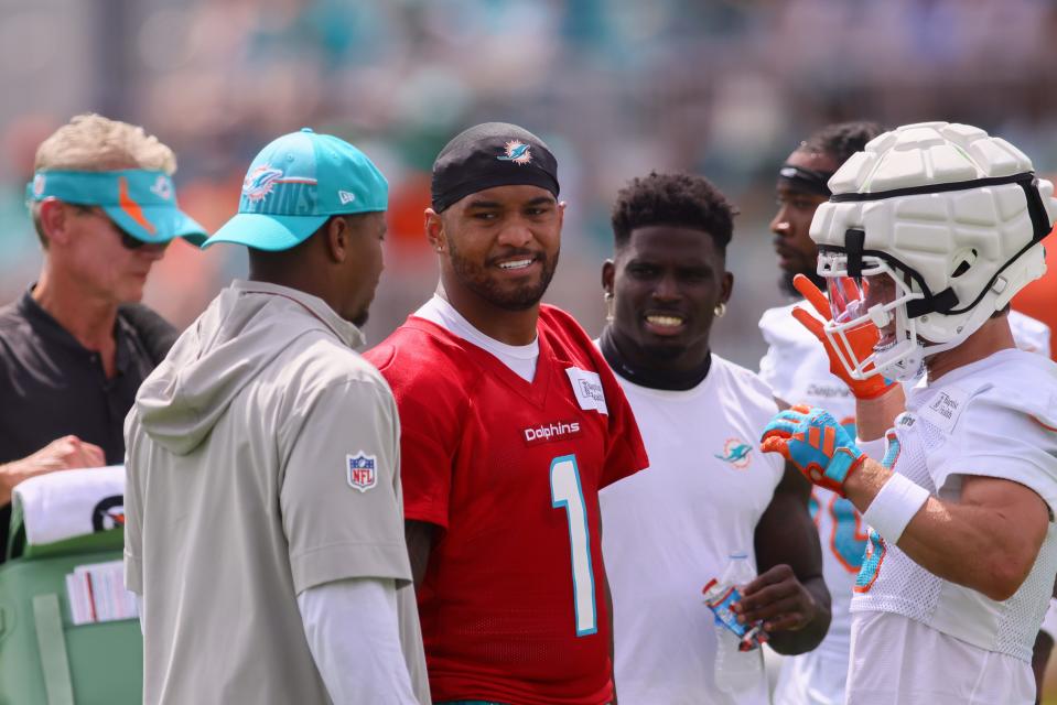 Jul 28, 2024; Miami Gardens, FL, USA; Miami Dolphins quarterback Tua Tagovailoa (1) looks on during training camp at Baptist Health Training Complex. Mandatory Credit: Sam Navarro-USA TODAY Sports