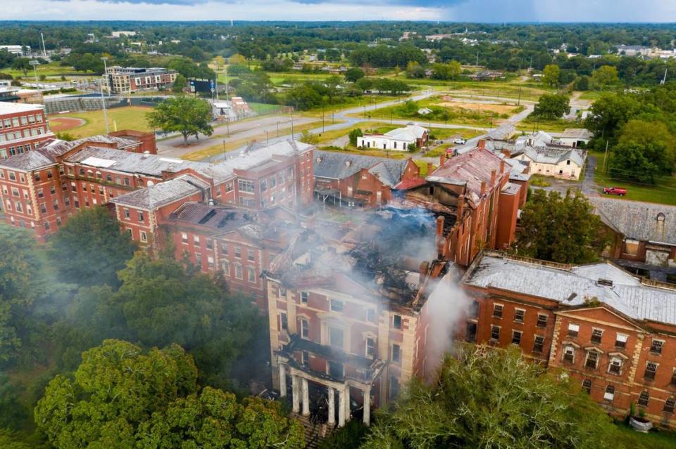 Smoke flows from where the cupola stood following a fire at the historic Babcock Building in the BullStreet District near downtown Columbia, SC, Sept. 12, 2020.