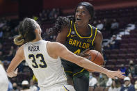 Baylor's Queen Egbo (4) fouls Michigan's Emily Kiser (33) as she drives to the basket in the first half of an NCAA college basketball game, Sunday, Dec. 19, 2021, in Uncasville, Conn. (AP Photo/Jessica Hill)