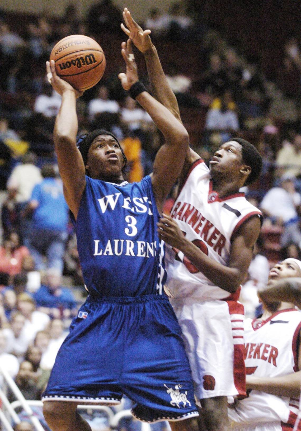 In this 2004 Telegraph file photo, West Laurens’ Demaryius Thomas draws a foul from Banneker’s Mychael Harris. Thomas would go on to play football for Georgia Tech and spend 10 seasons in the NFL with the Broncos, Texans and Jets. He died Thursday at age 33.